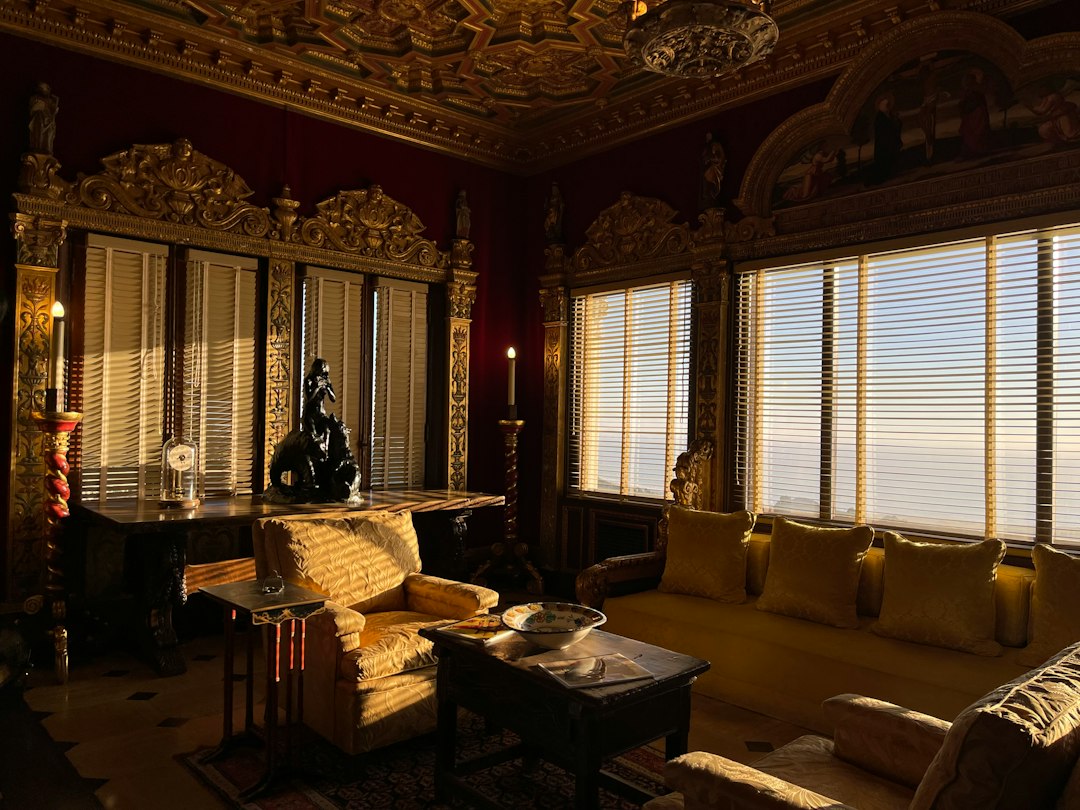 a living room filled with furniture and windows